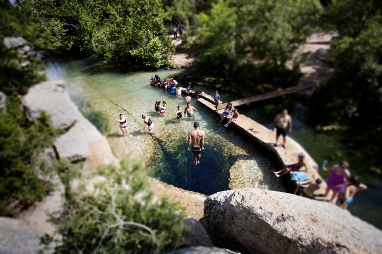A group of people swimming in Jacob's Well