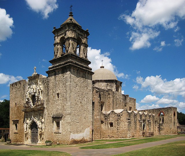 Photograph of an old spanish mission in exasagainst a blue sky