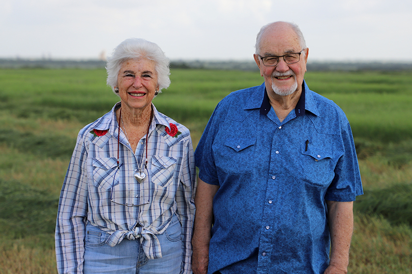 The Steubing's posed for a photo in front of a field