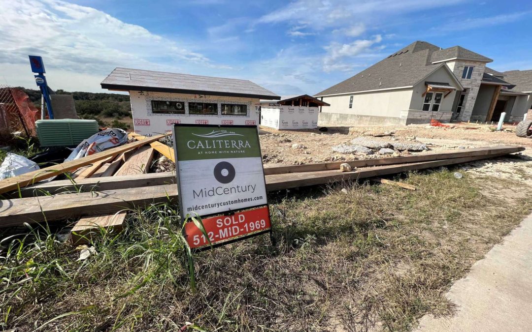Photo of a home in development with a "for sale" sign